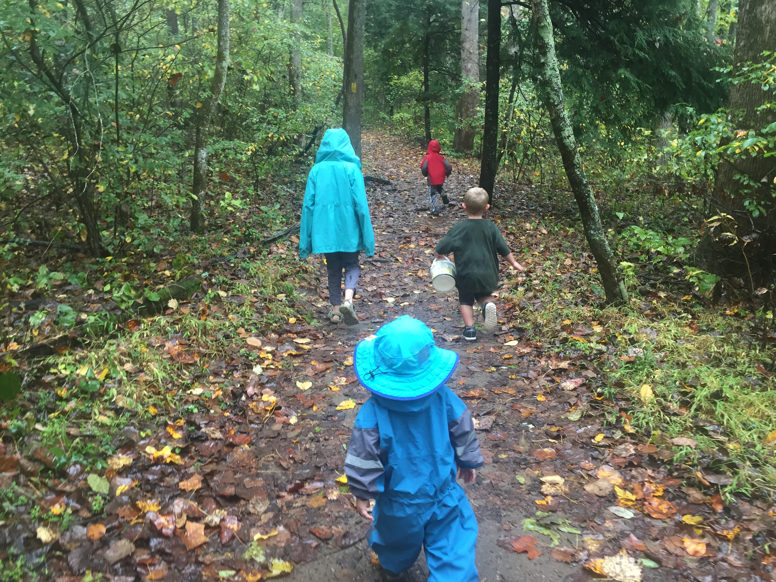 Hiking in the rain doesn't have to be miserable. If you're prepared, it can be fun for the whole family. Go to ouradventuringfamily.com to read the four things that helped us.