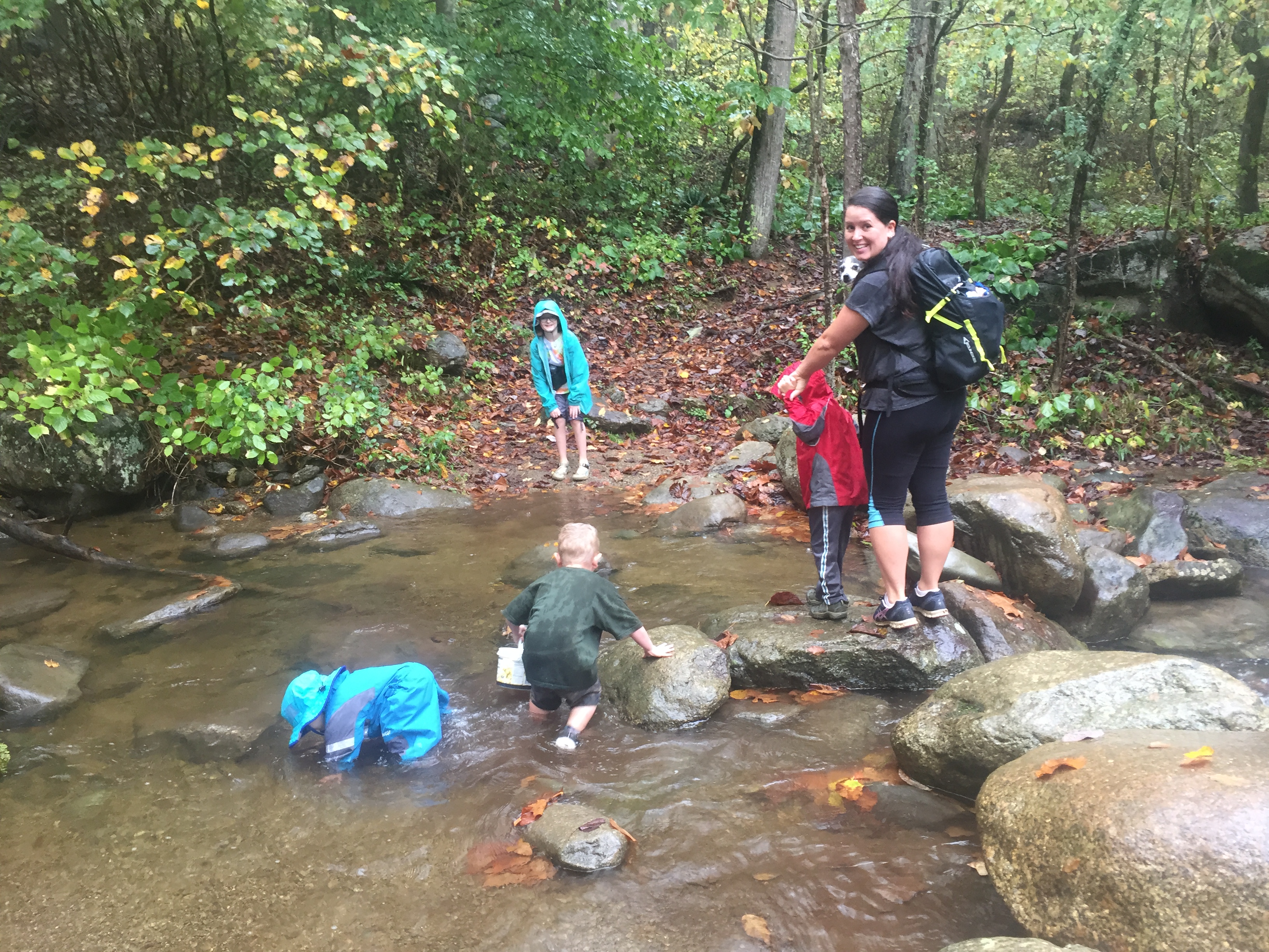 Hiking in the rain doesn't have to be miserable. If you're prepared, it can be fun for the whole family. Go to ouradventuringfamily.com to read the four things that helped us.